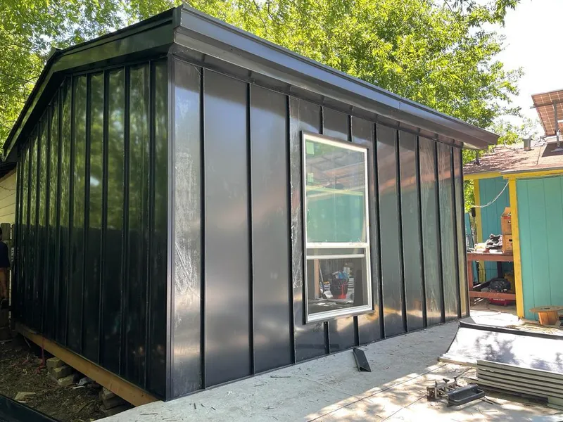 Black standing seam metal wall panels for Roof Inspection in Monitor