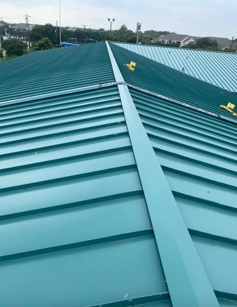 Green commercial metal roof ridge and valley for Metal Roof Repair in Monitor